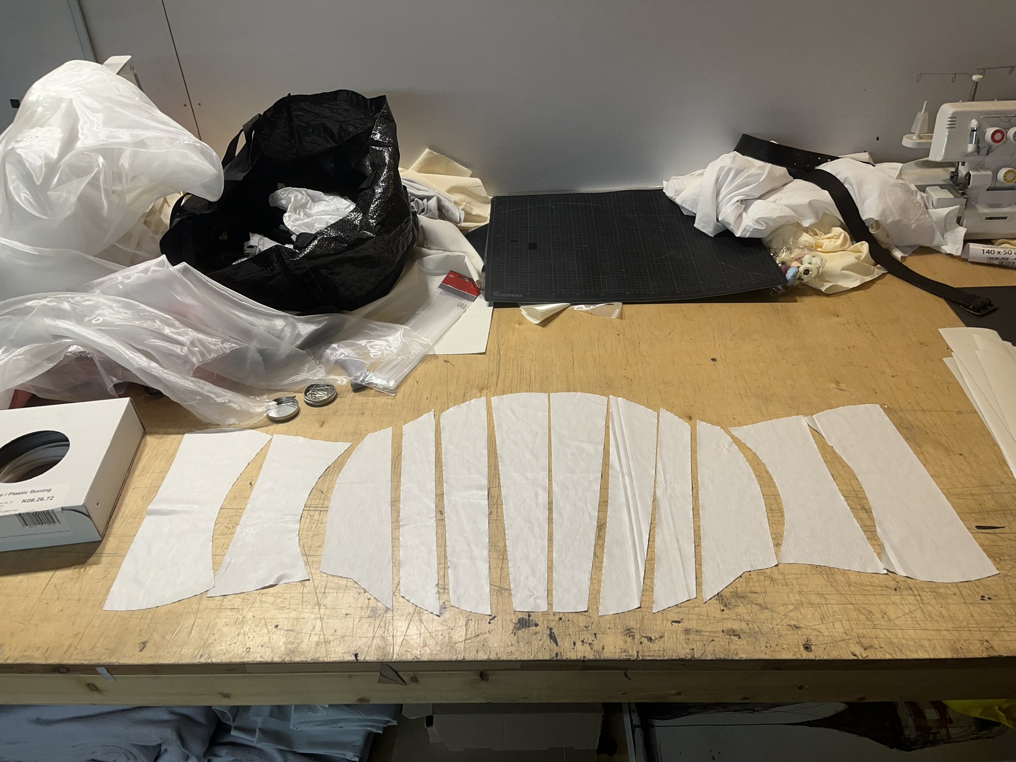 Cut pattern pieces laid on table, ready for real garment production