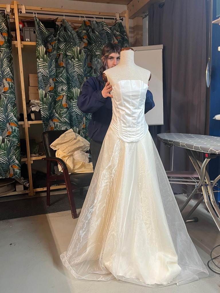 Behind-the-scenes of bridal corset and skirt ensemble in workshop