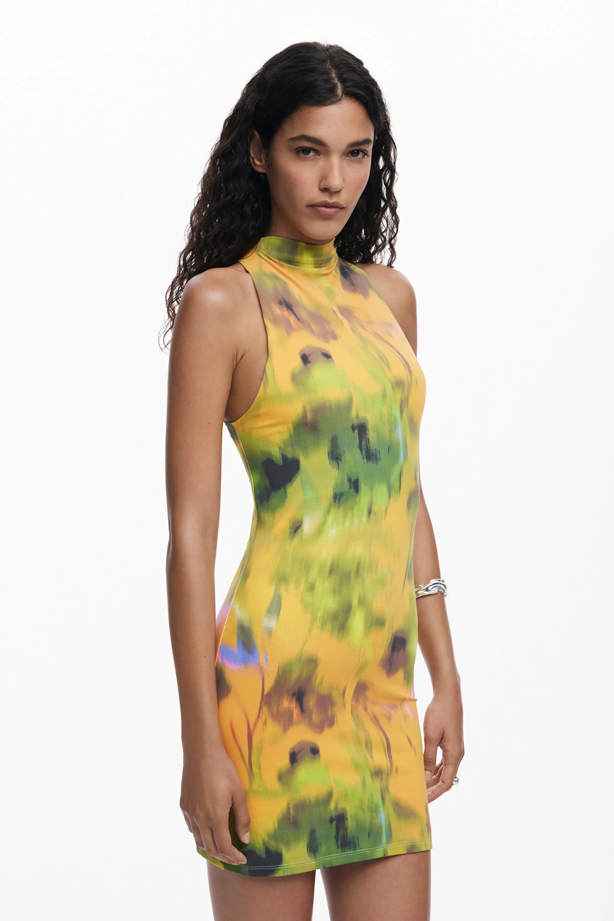 A bodycon dress with built-up neckline collar, fitted side seams and mini-length hem. The dress features a built in neckline and a shoulder point of 4cm from the right neck. Bottom armholes are dropped 4cm. The dress features a front and a back panel.