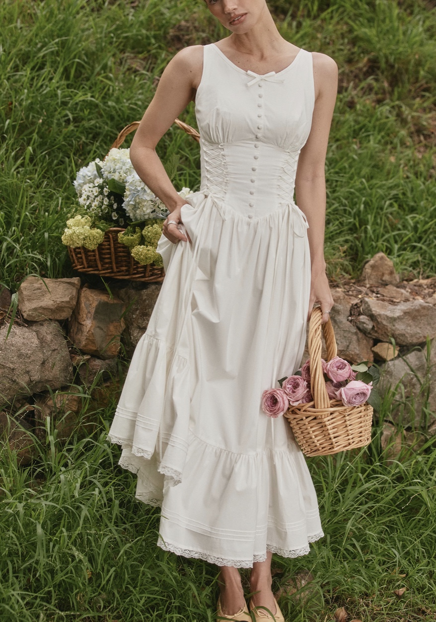 Milkmaid dress pattern - A romantic, fit-and-flare midi dress featuring a structured bustier bodice and a voluminous two-tier skirt with gathered upper chest piece and princess seams.